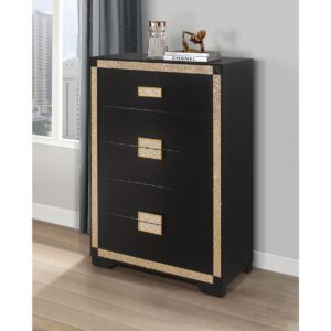 A black and gold chest of drawers with a wooden frame.