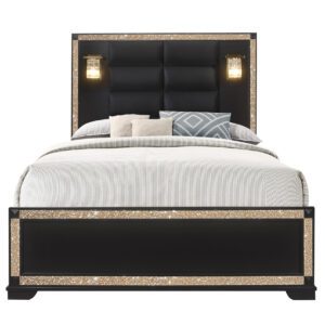 A bed with lights on the headboard and footboard.